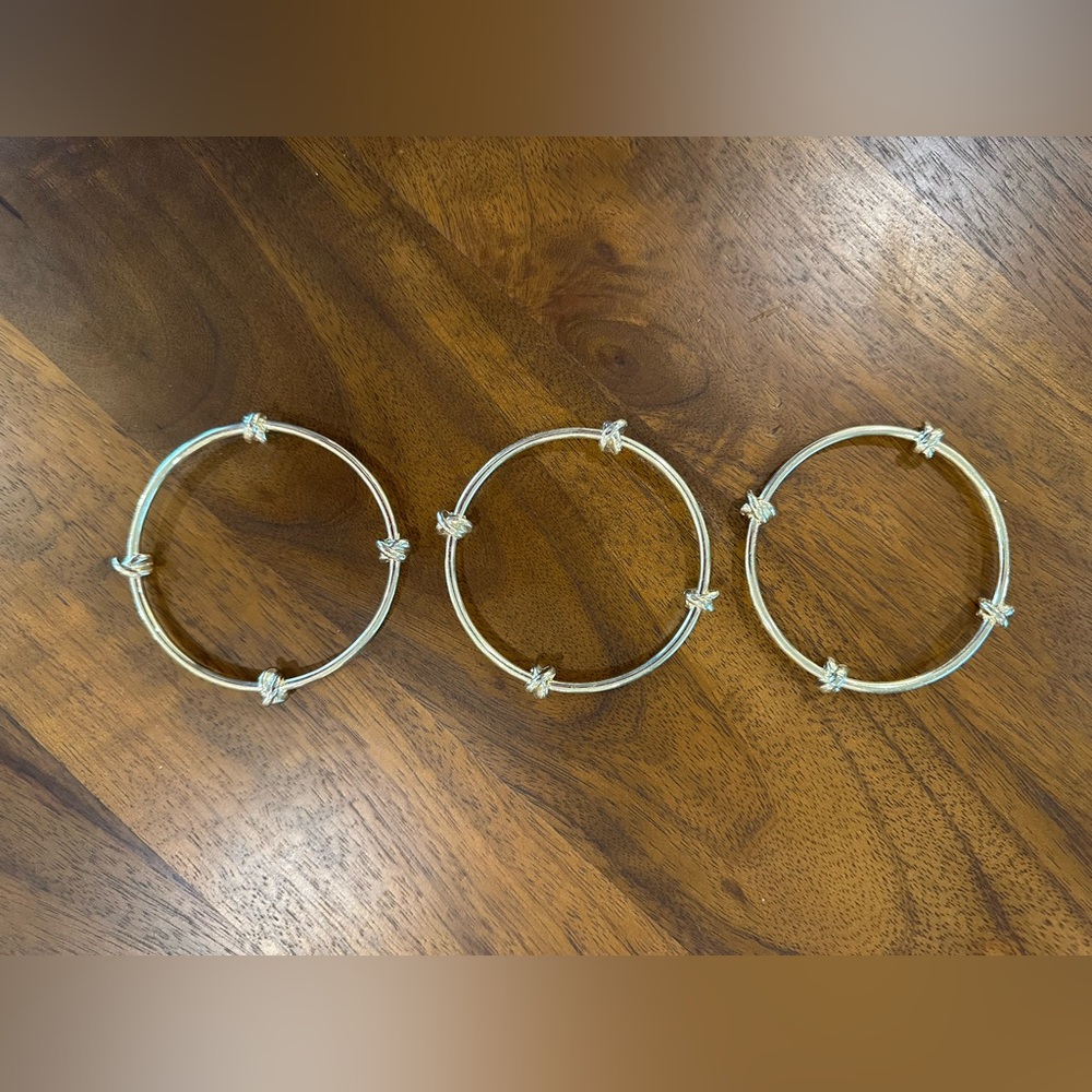 Madewell gold tone bangle bracelets.  Embellished with 4 knots on each bangle